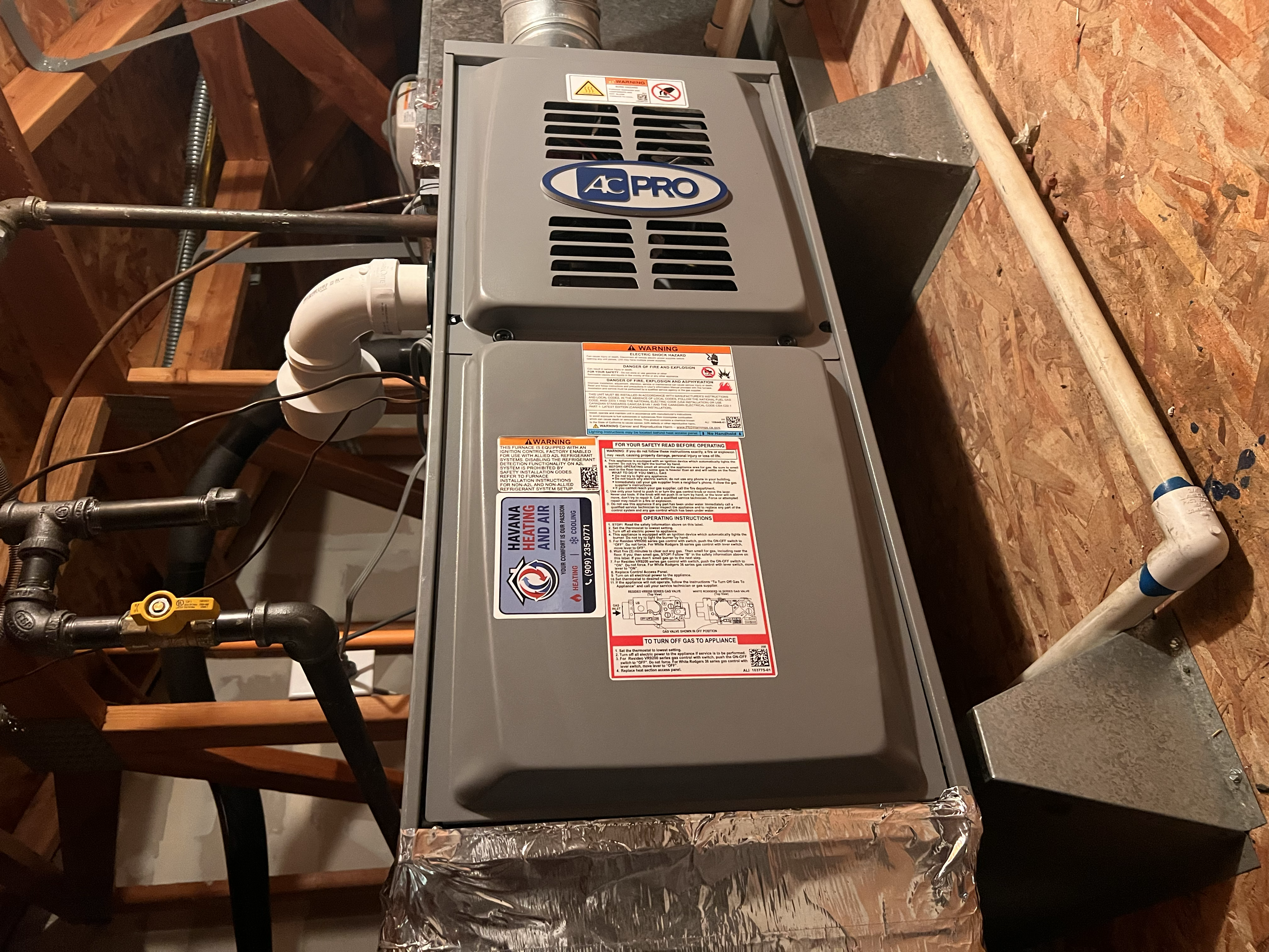 Newly installed furnace with Havana Heating and Air service sticker