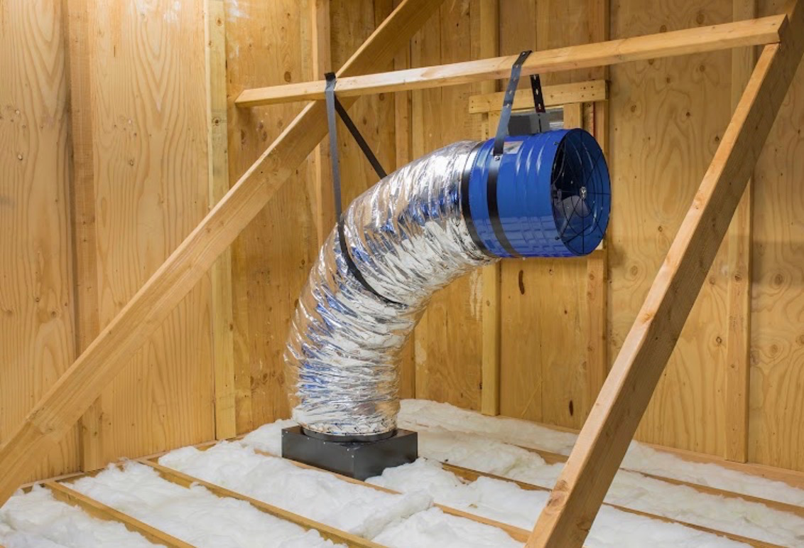 QuietCool whole-house fan installed in an attic with insulated ducting
